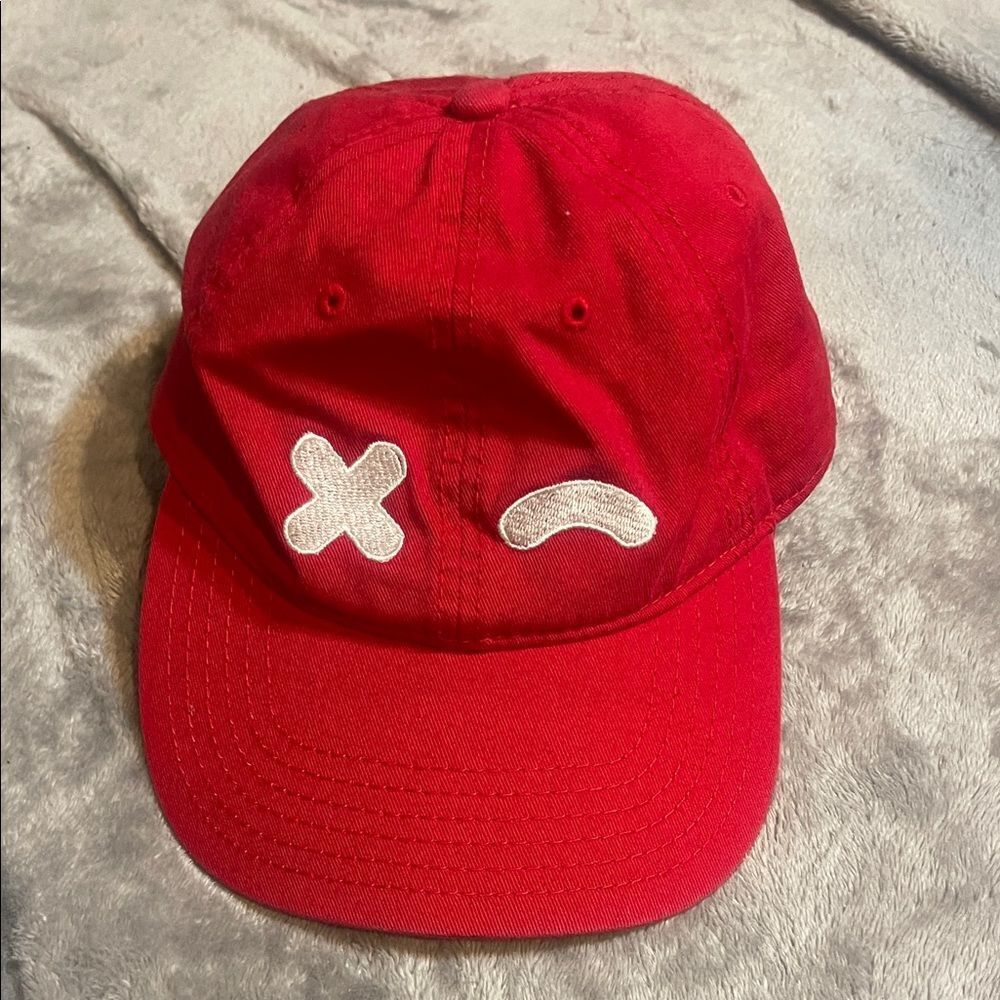 Red wink, baseball hat